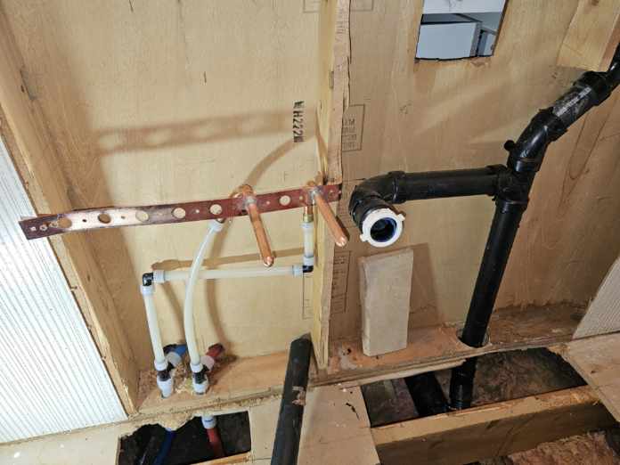 Precision Plumbing Setup for Wall and Floor